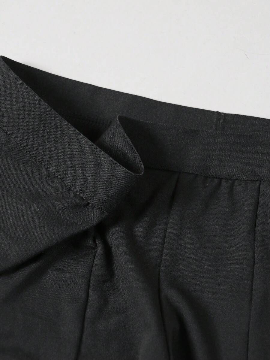 Black men's elephant pouch boxer shorts featuring letter print design and high-stretch fabric.