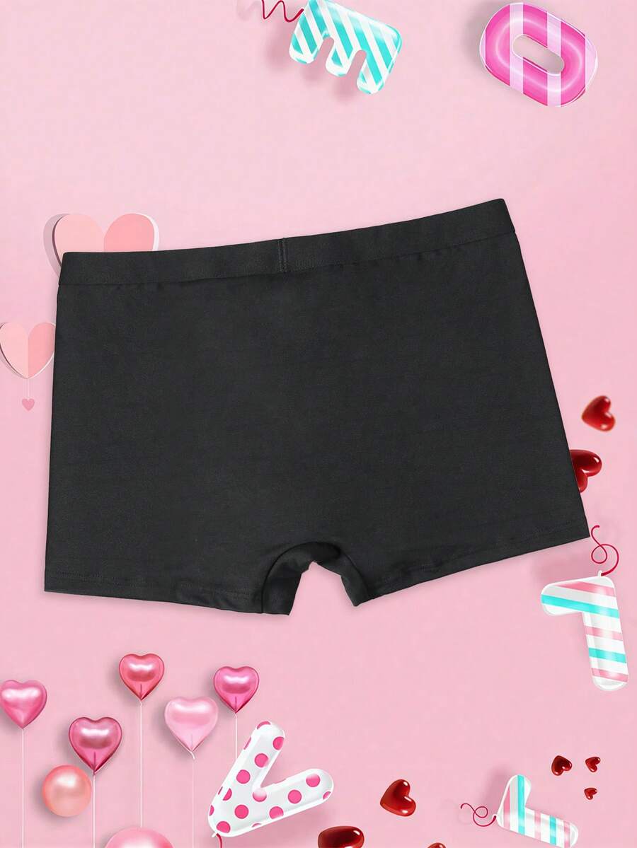 Black men's elephant pouch boxer shorts featuring letter print design and high-stretch fabric.
