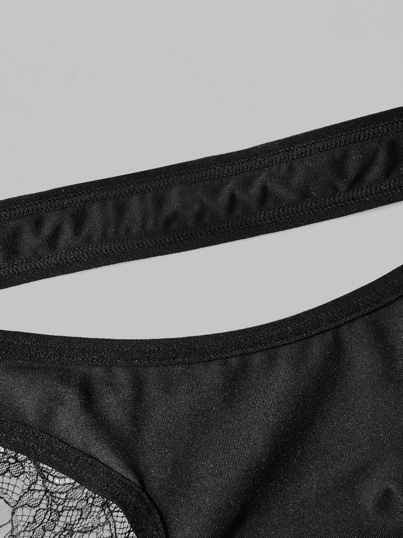 Men's black lace thong lingerie with a low-rise fit, medium-stretch fabric, and unlined design for party or Halloween wear.