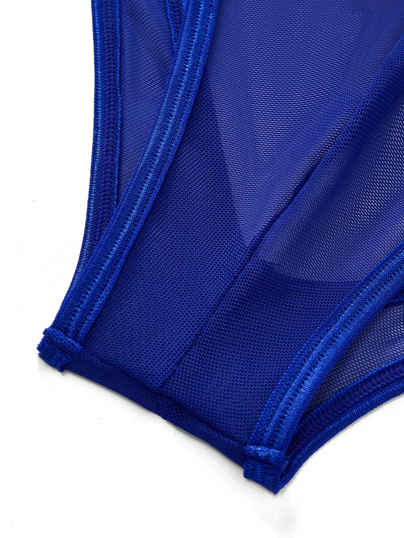 Men's mesh backless bodysuit lingerie with scoop neck, low rise fit, thong back, and suspender style for intimate occasions.