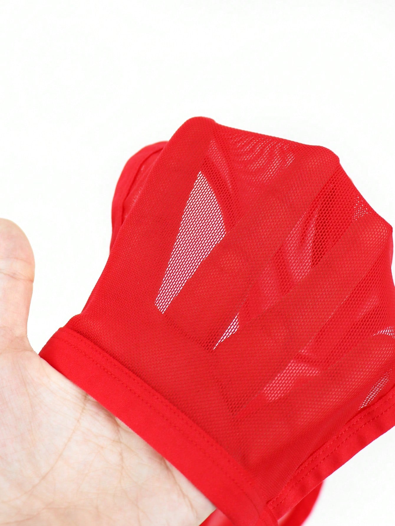 Red men's mesh briefs with tassel detail, mid rise fit, colorblock design, and medium stretch fabric.