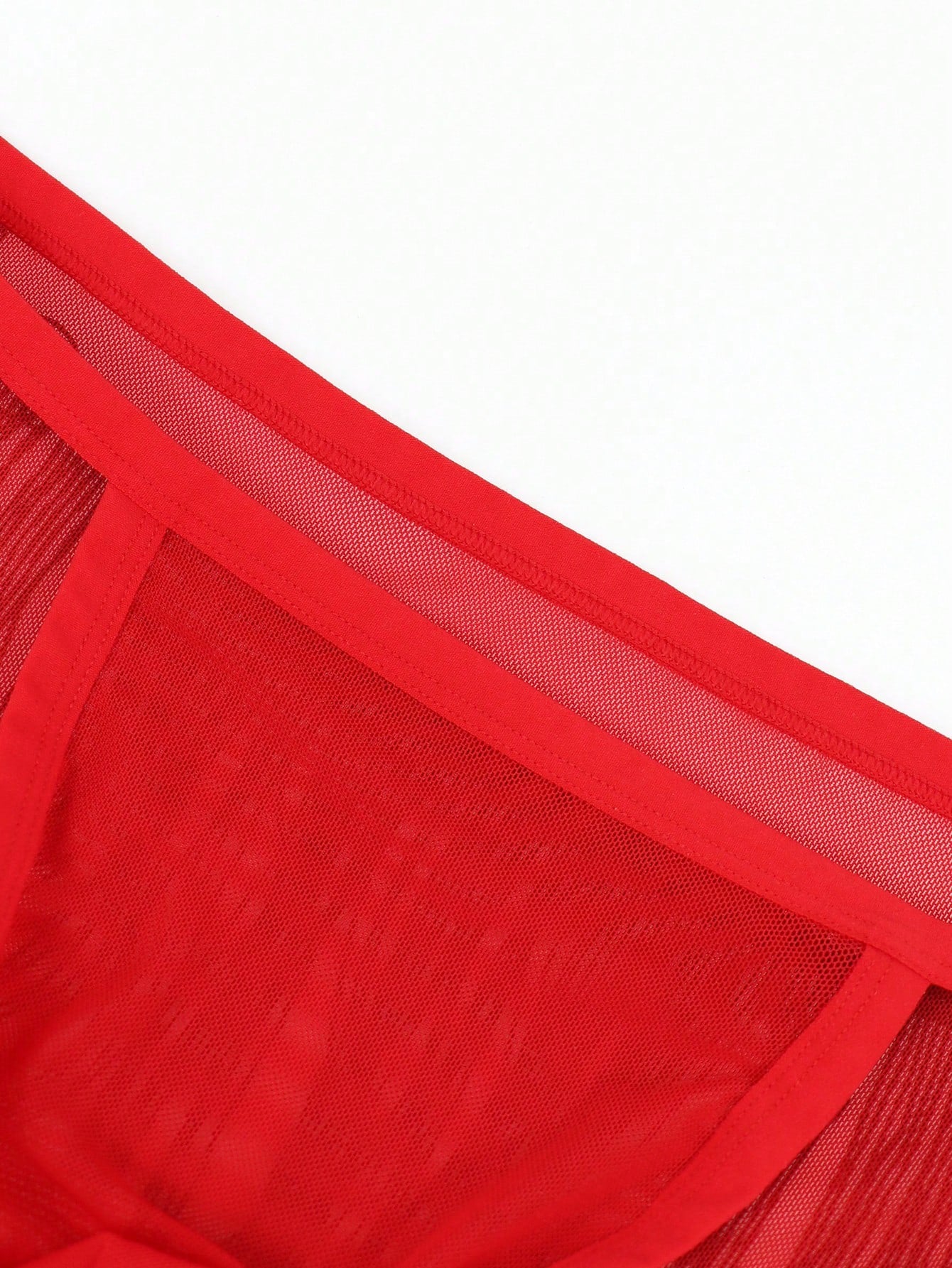 Red men's mesh briefs with tassel detail, mid rise fit, colorblock design, and medium stretch fabric.