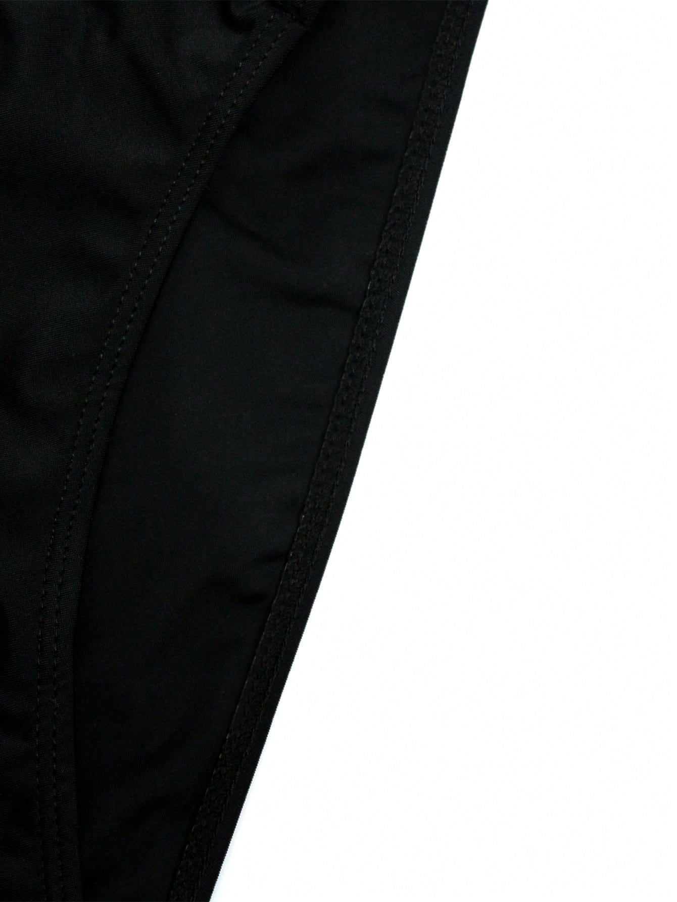 Men's solid swim briefs with O-ring detail, high waist, short racer cut, and high-stretch polyamide elastane fabric.