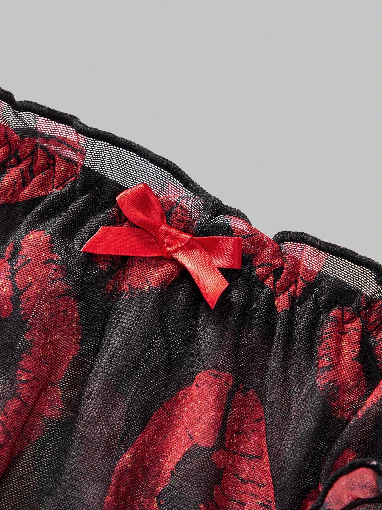 Men's low rise mesh briefs lingerie with random print design, high-stretch fabric, and unlined construction.