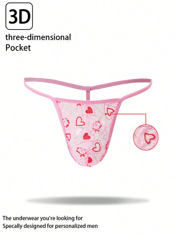 Pink men's lace thong underwear with geometric and floral-inspired print, low-rise waist, unlined design, and medium-stretch fabric.