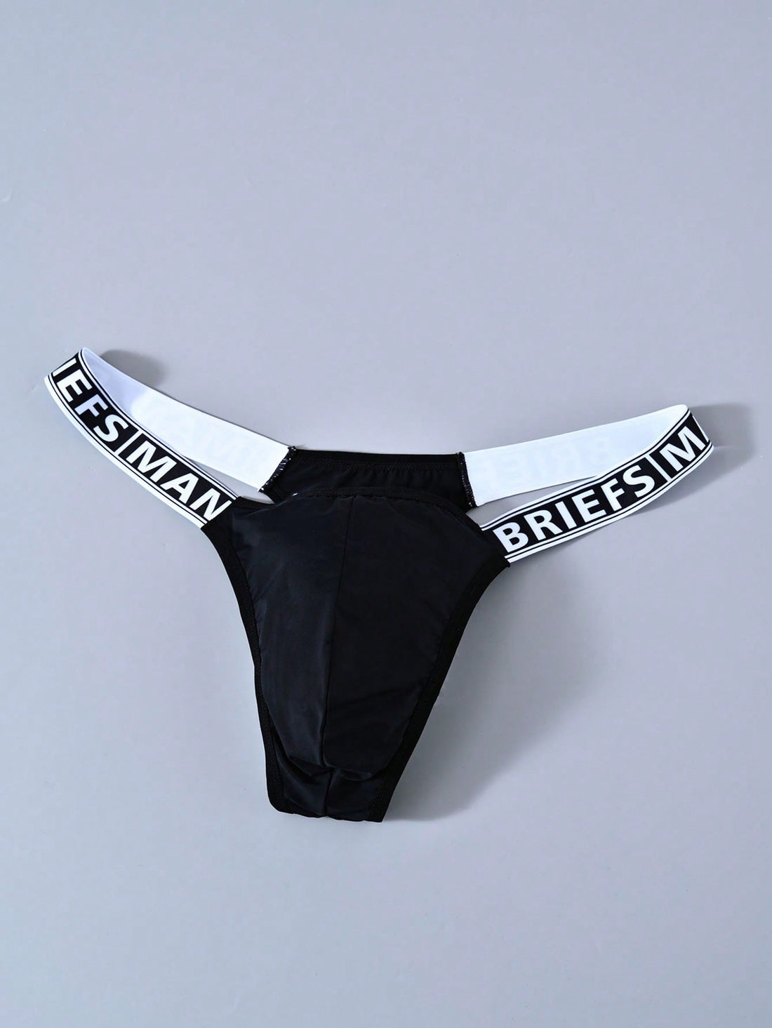Men's mid rise thong underwear with textured pattern and letter-style tape waistband, made from polyester elastane stretch fabric.