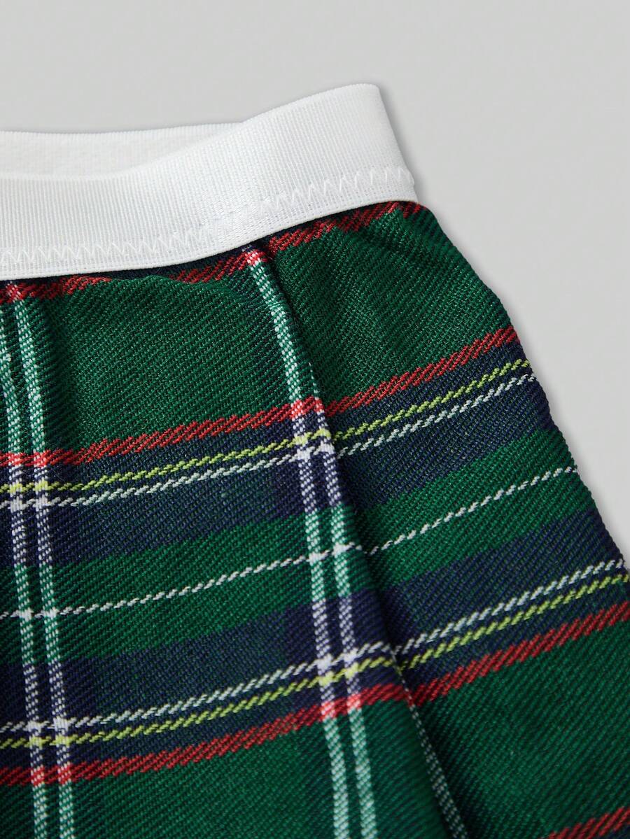 Men's low rise plaid Christmas thong in multicolor red designed for holiday roleplay and couples.