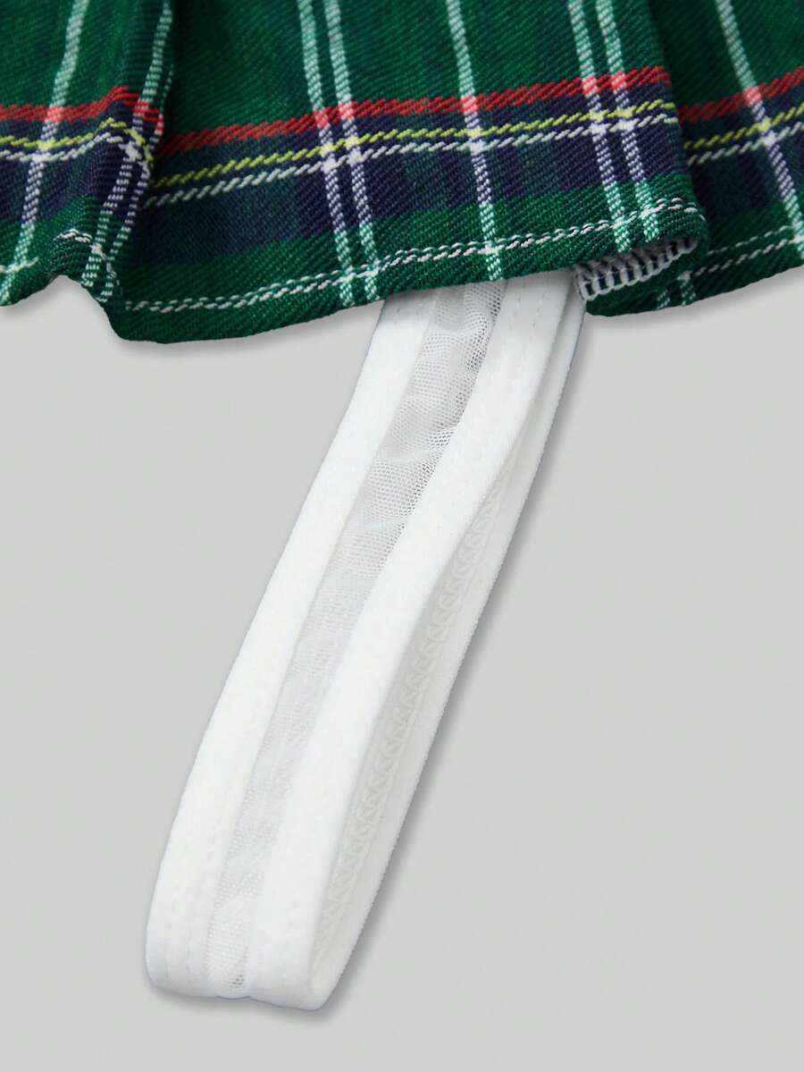 Men's low rise plaid Christmas thong in multicolor red designed for holiday roleplay and couples.