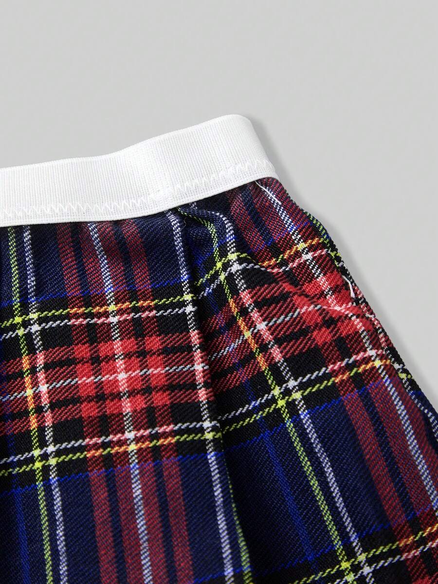 Men's low rise plaid Christmas thong in multicolor red designed for holiday roleplay and couples.