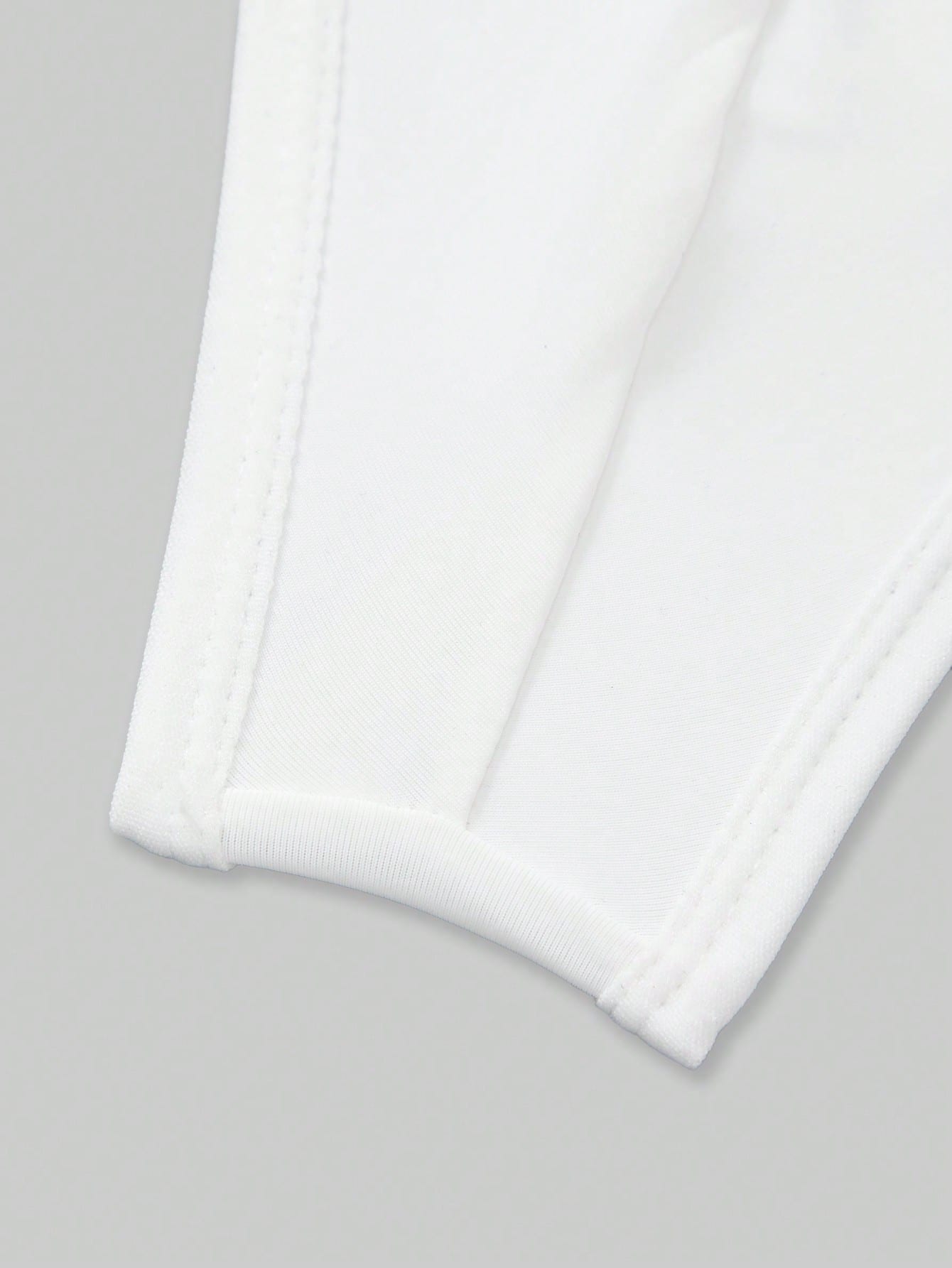 3-pack men's low rise thong underwear in assorted multicolor plain design, made from stretchy knitted polyamide and elastane fabric.