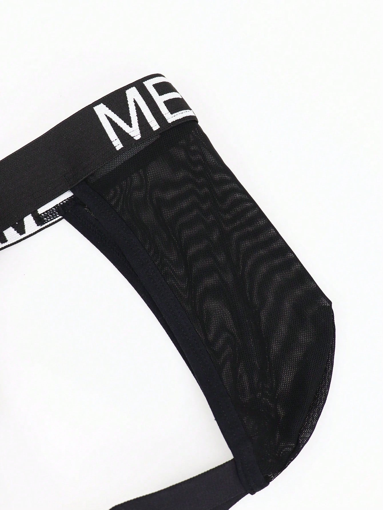 Men's low rise mesh jockstrap underwear with letter pattern, medium stretch fabric, made from 92% polyamide and 8% elastane.