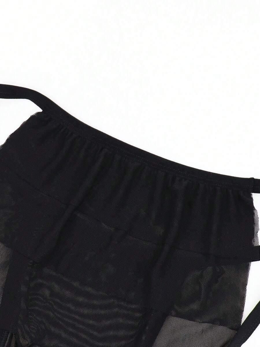 Men's black mesh jockstrap underwear featuring sheer hollow design and low rise fit.