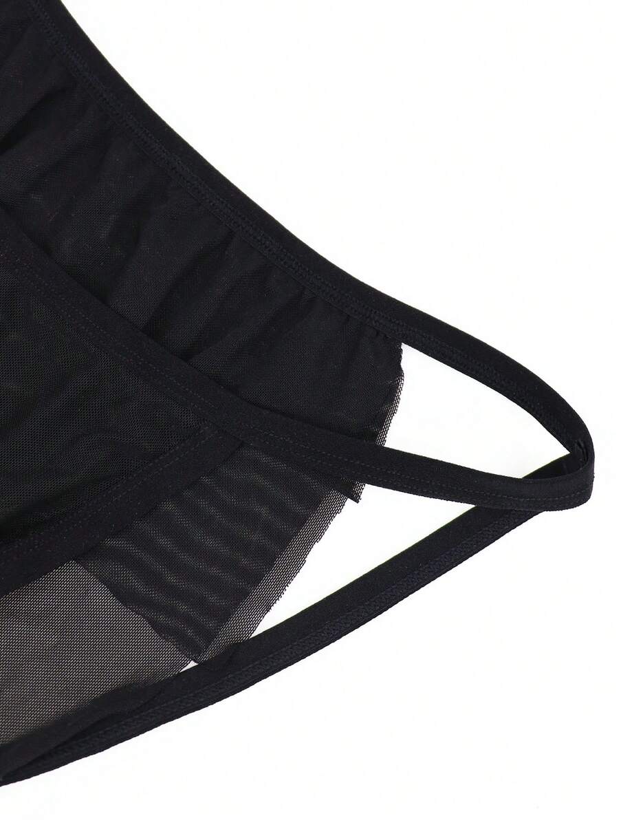 Men's black mesh jockstrap underwear featuring sheer hollow design and low rise fit.