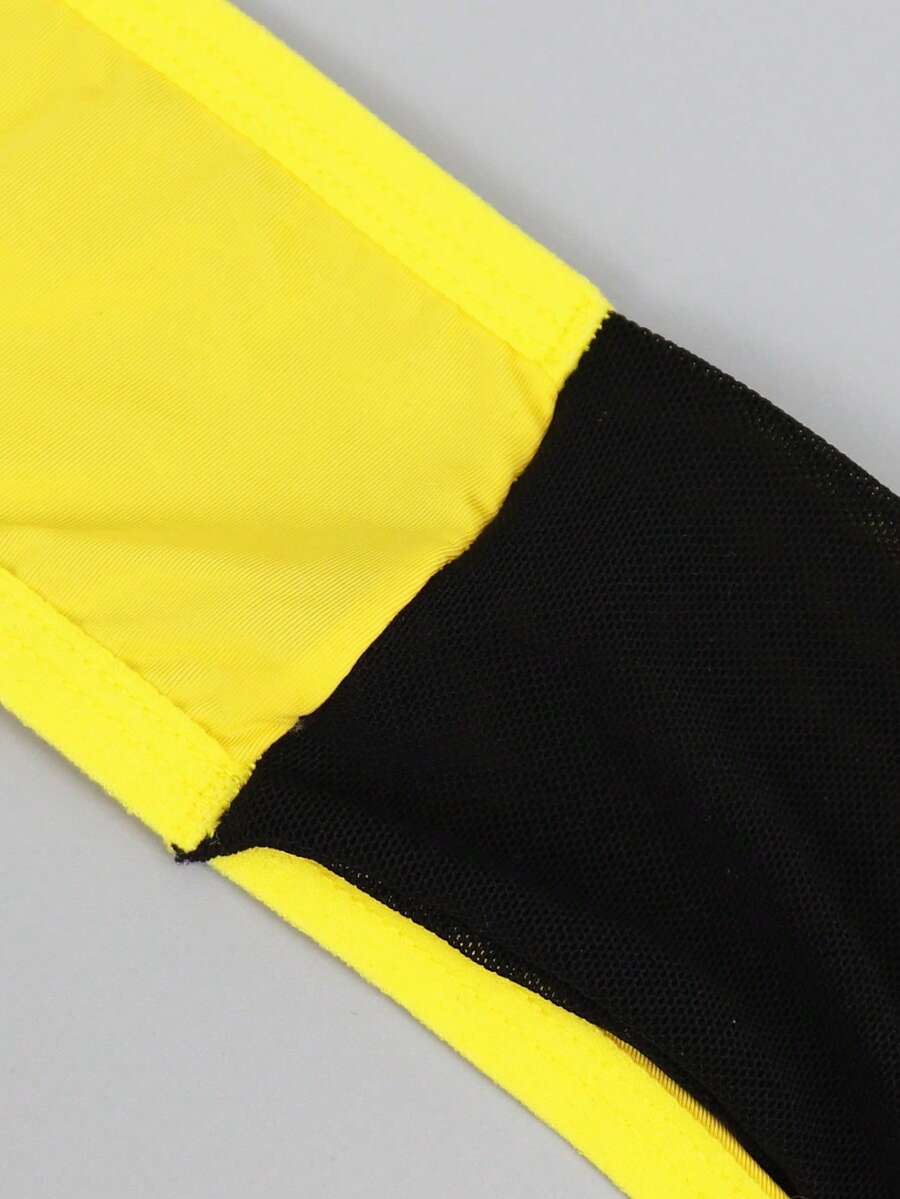 Men's multicolor mid-rise thong underwear featuring contrast mesh details and a colorblock pattern.