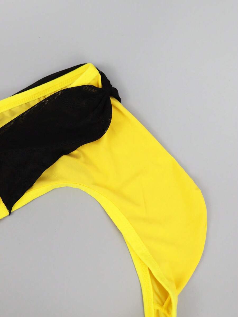 Men's multicolor mid-rise thong underwear featuring contrast mesh details and a colorblock pattern.