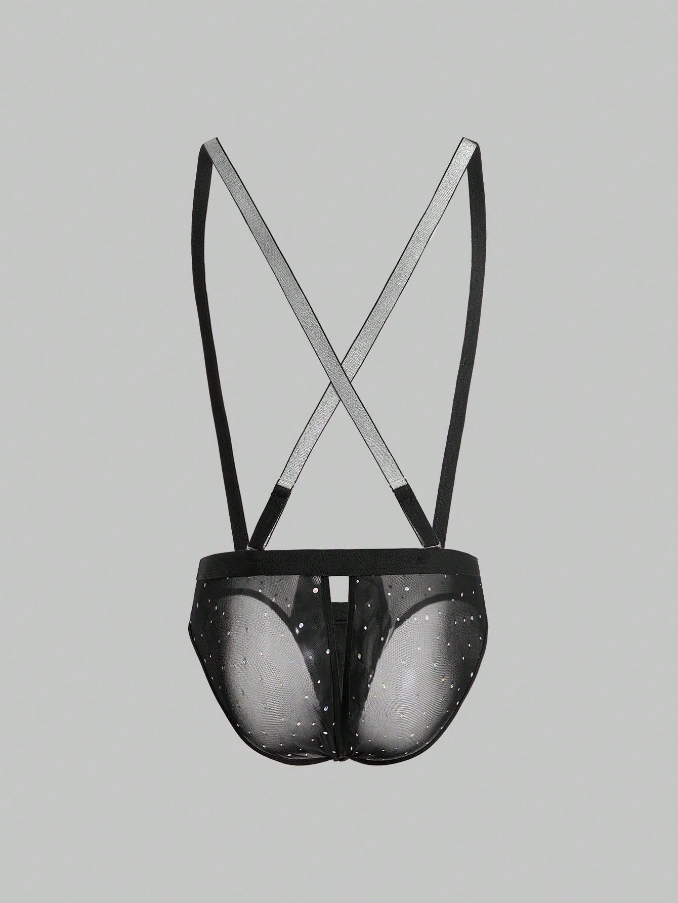 Black men's lingerie briefs with a backless low rise design, plain pattern, and high-stretch knitted fabric for party wear.