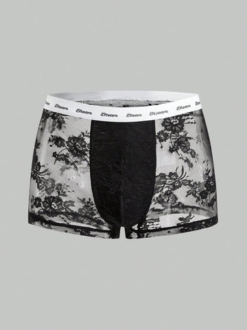 Men's black and white lace trim briefs with letter and plant pattern, regular fit, slight stretch, made from polyamide and elastane.