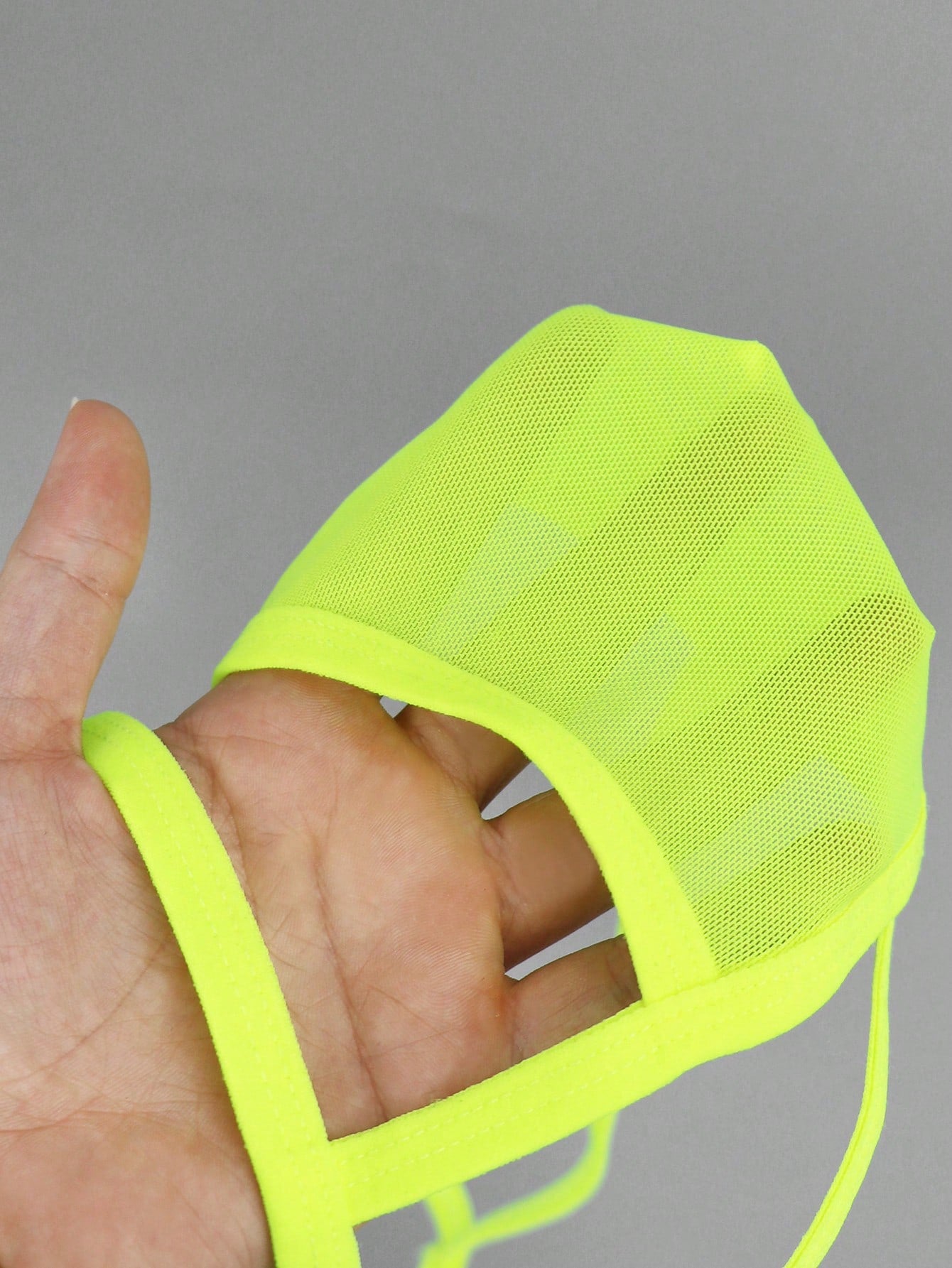 Men's yellow colorblock mesh thong underwear with a low-rise fit and medium-stretch fabric, designed as 1-piece sexy underwear for party wear.