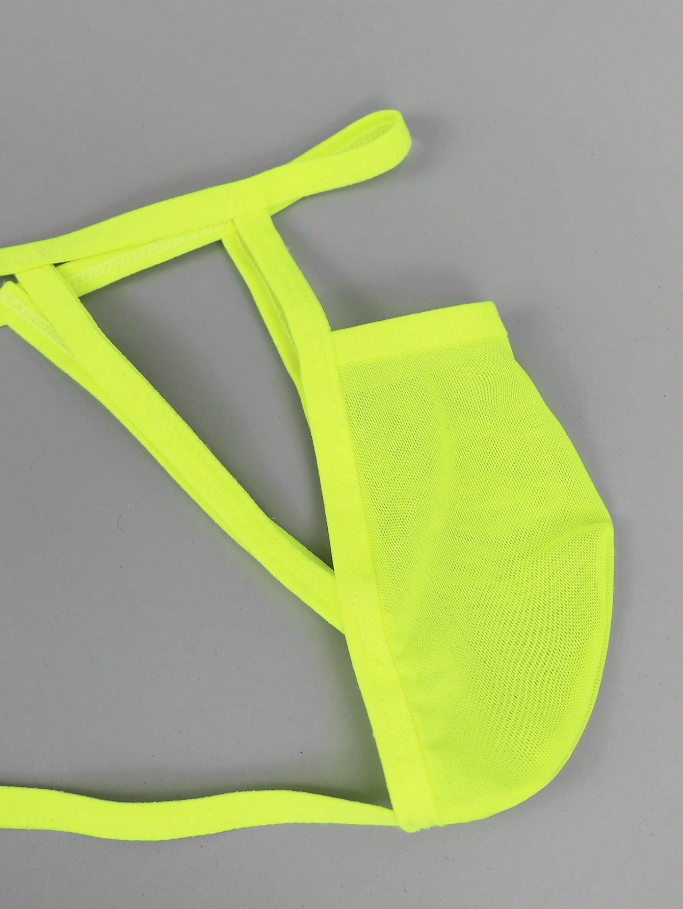 Men's yellow colorblock mesh thong underwear with a low-rise fit and medium-stretch fabric, designed as 1-piece sexy underwear for party wear.