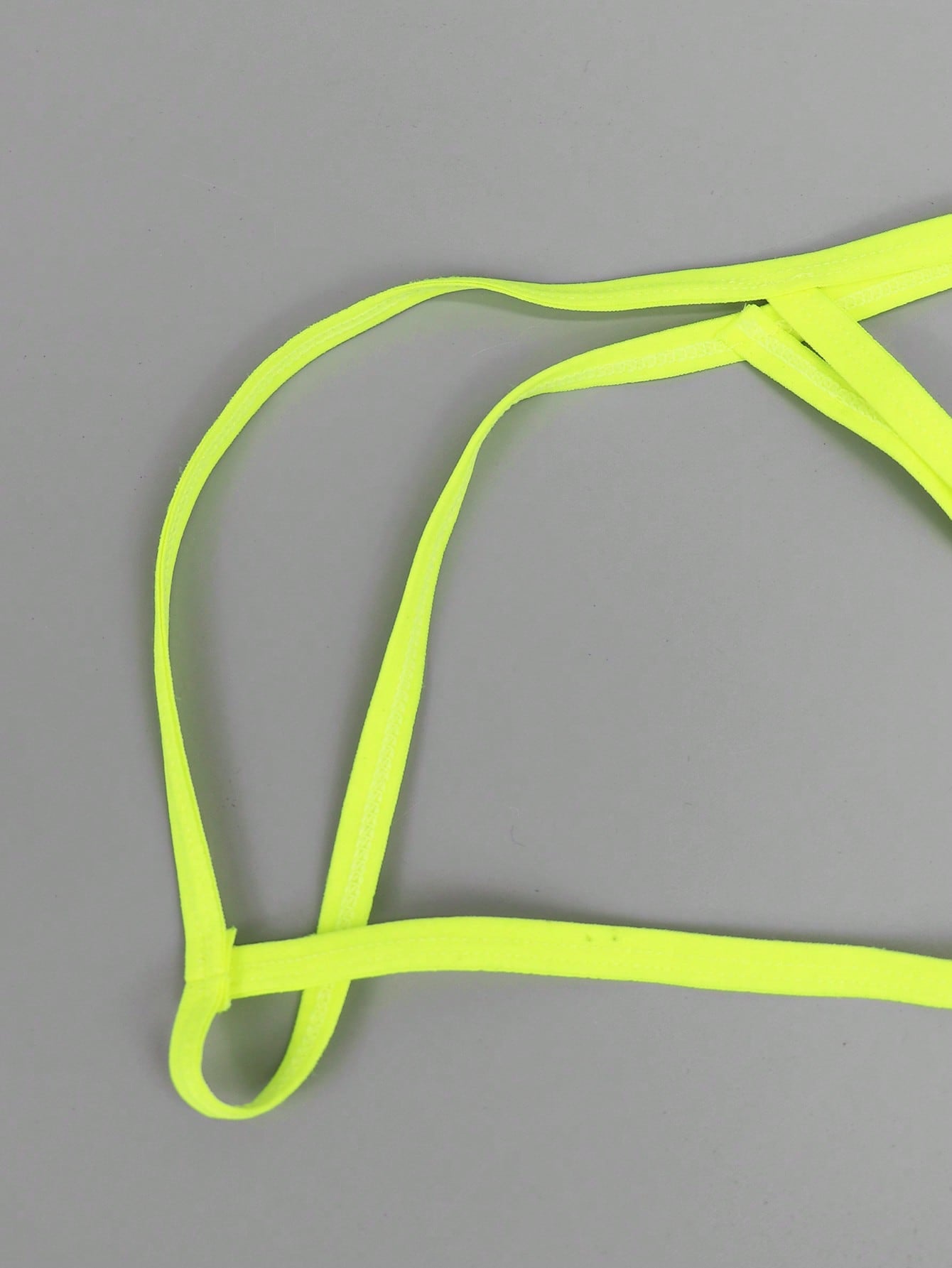 Men's yellow colorblock mesh thong underwear with a low-rise fit and medium-stretch fabric, designed as 1-piece sexy underwear for party wear.