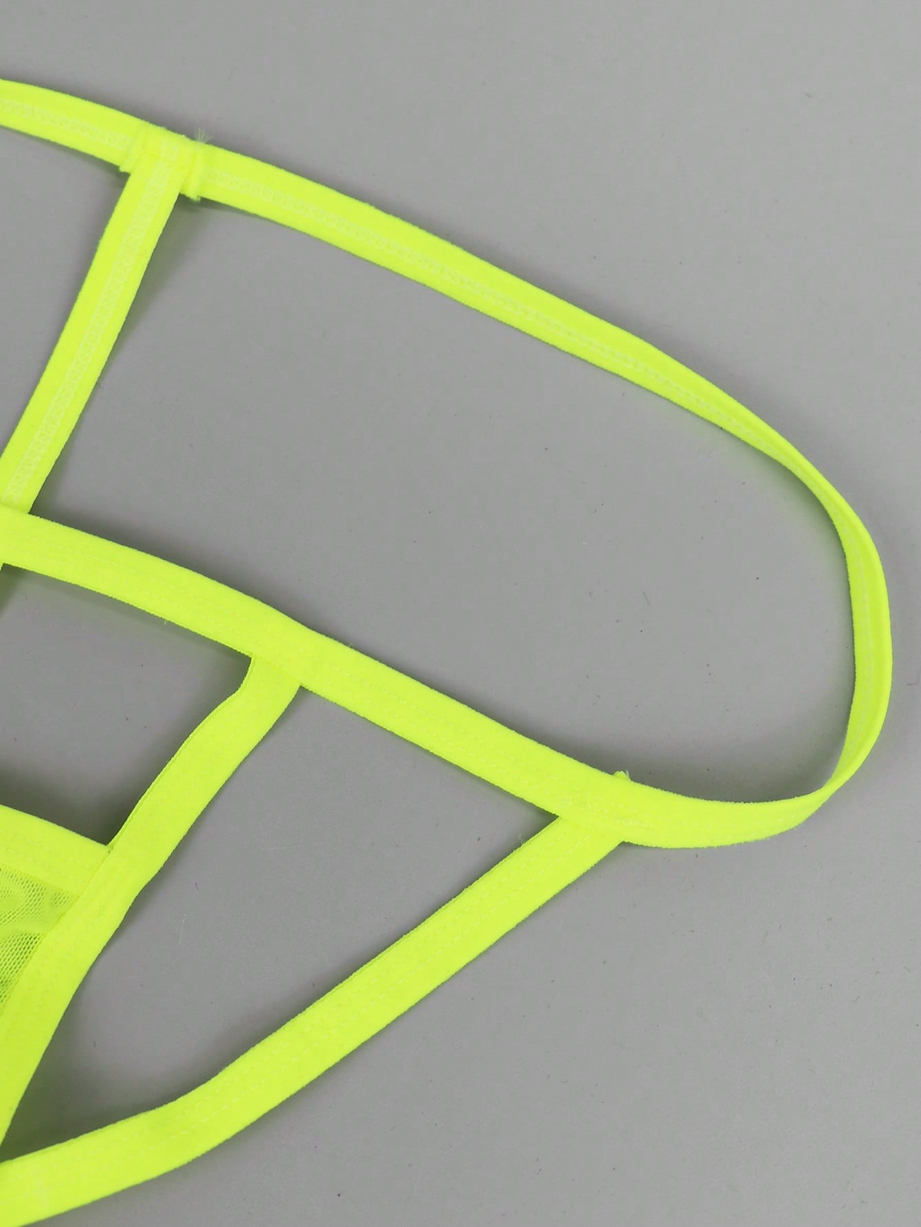 Men's yellow colorblock mesh thong underwear with a low-rise fit and medium-stretch fabric, designed as 1-piece sexy underwear for party wear.