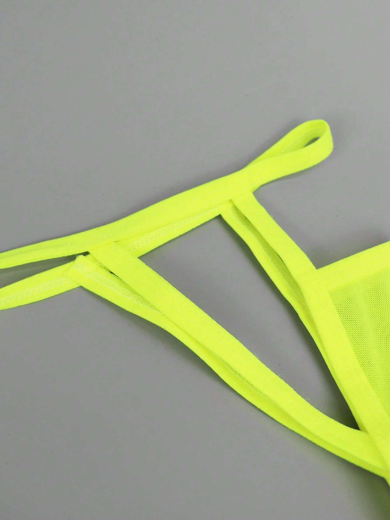 Men's yellow colorblock mesh thong underwear with a low-rise fit and medium-stretch fabric, designed as 1-piece sexy underwear for party wear.