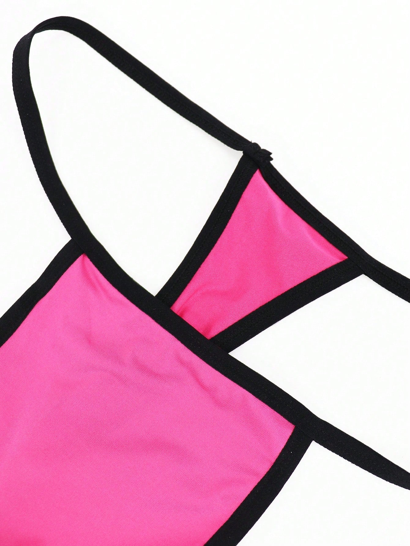 Hot pink men's thong underwear in knitted fabric with contrast binding, colorblock design, and mid-rise fit.