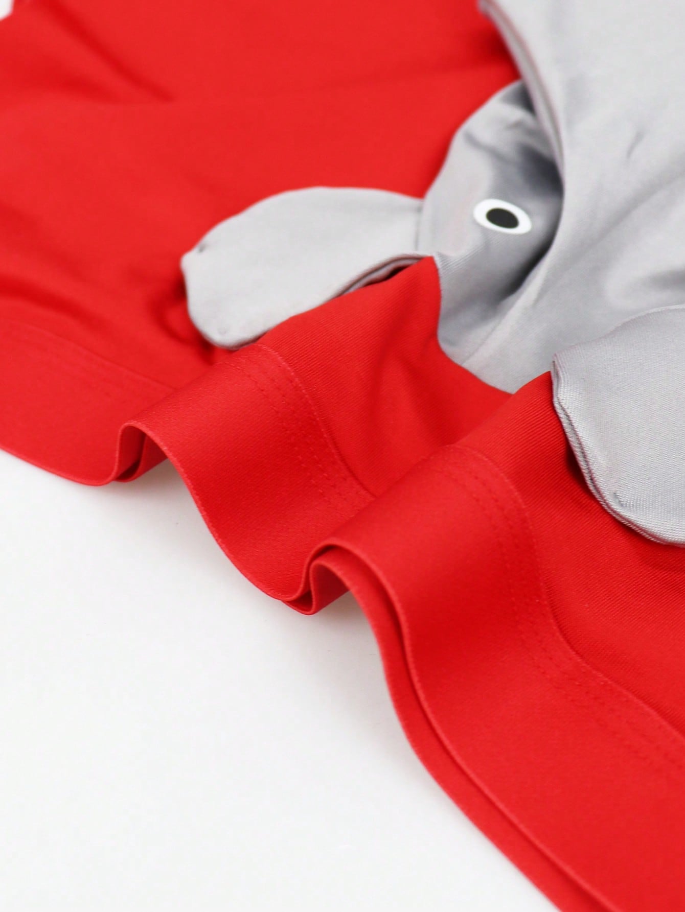 Men's mid-rise boxer shorts in red knitted fabric with medium stretch, featuring animal and cartoon pattern details.