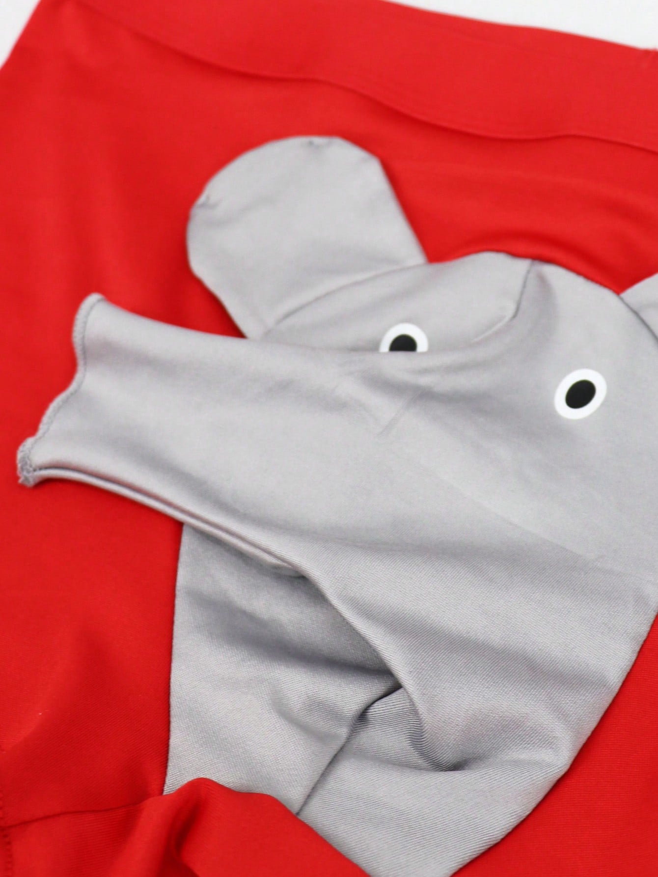 Men's mid-rise boxer shorts in red knitted fabric with medium stretch, featuring animal and cartoon pattern details.