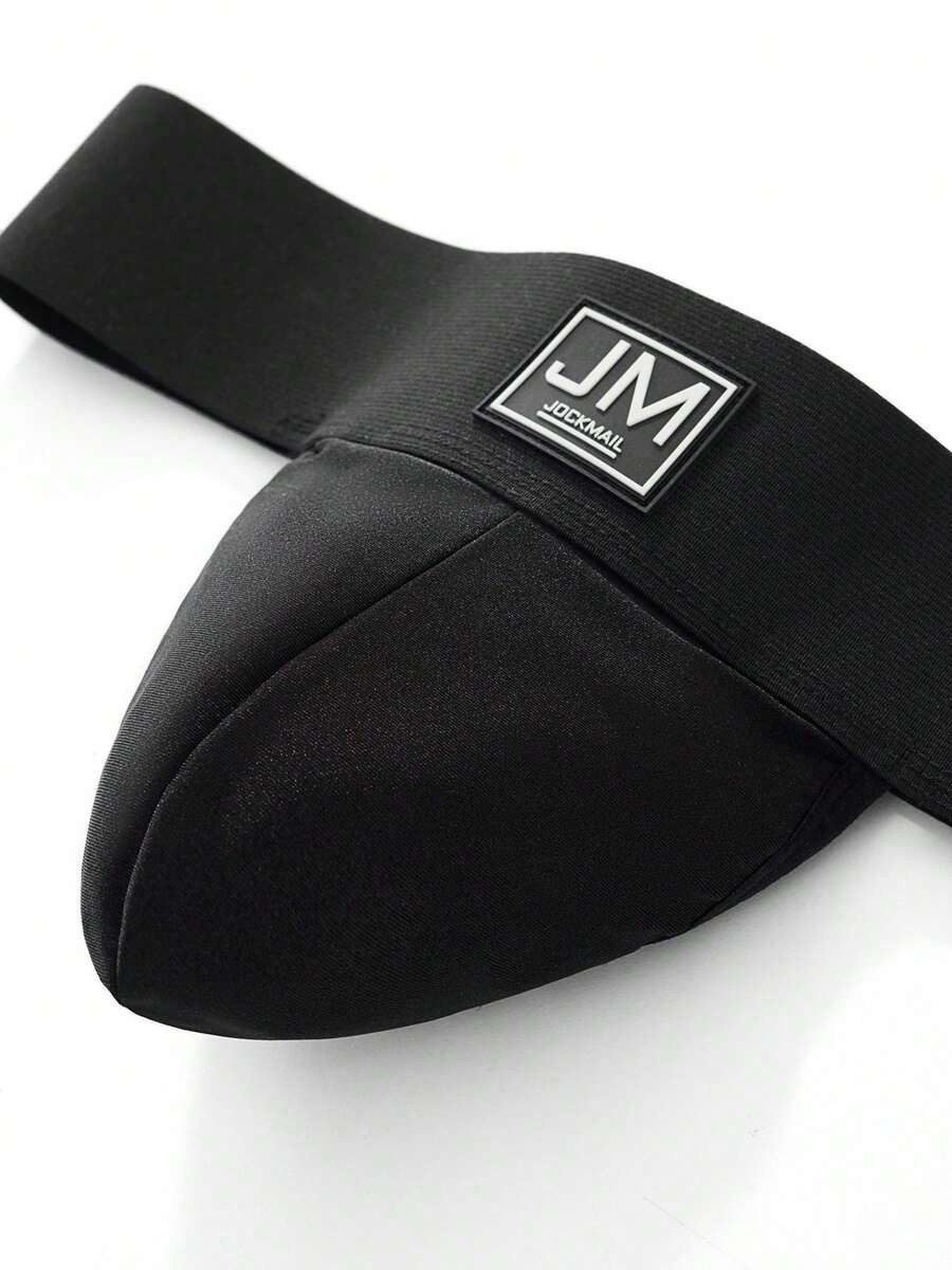Black low rise men's jockstrap underwear featuring a letter print wide waistband