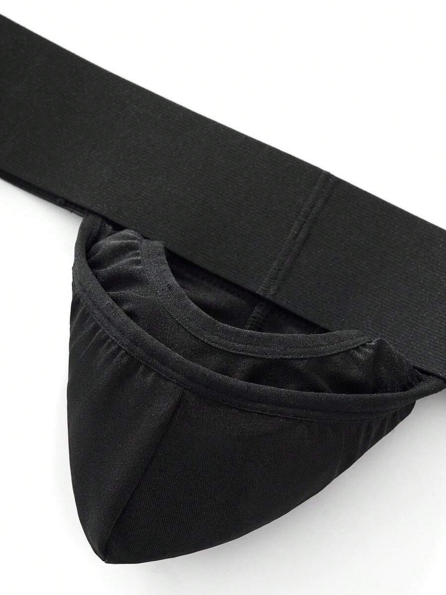 Black low rise men's jockstrap underwear featuring a letter print wide waistband