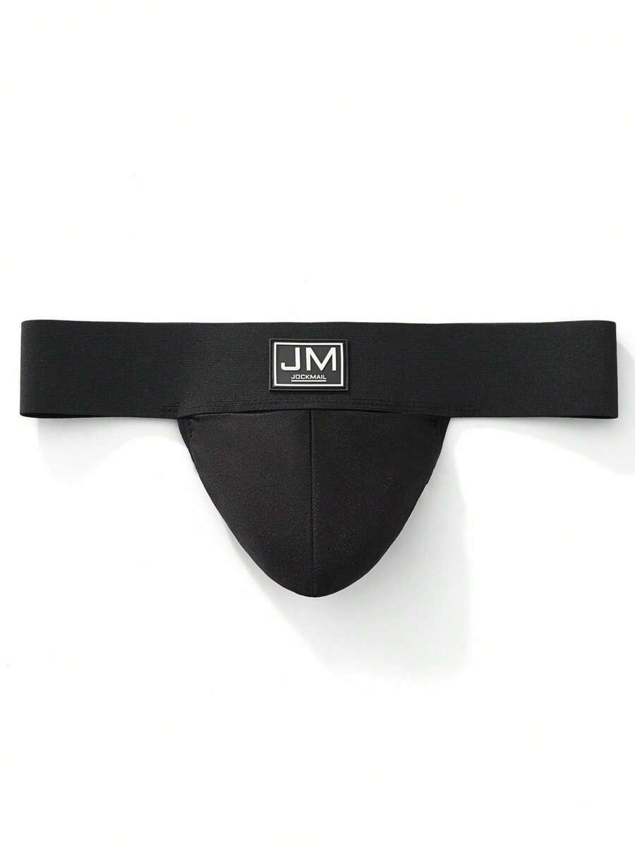 Black low rise men's jockstrap underwear featuring a letter print wide waistband
