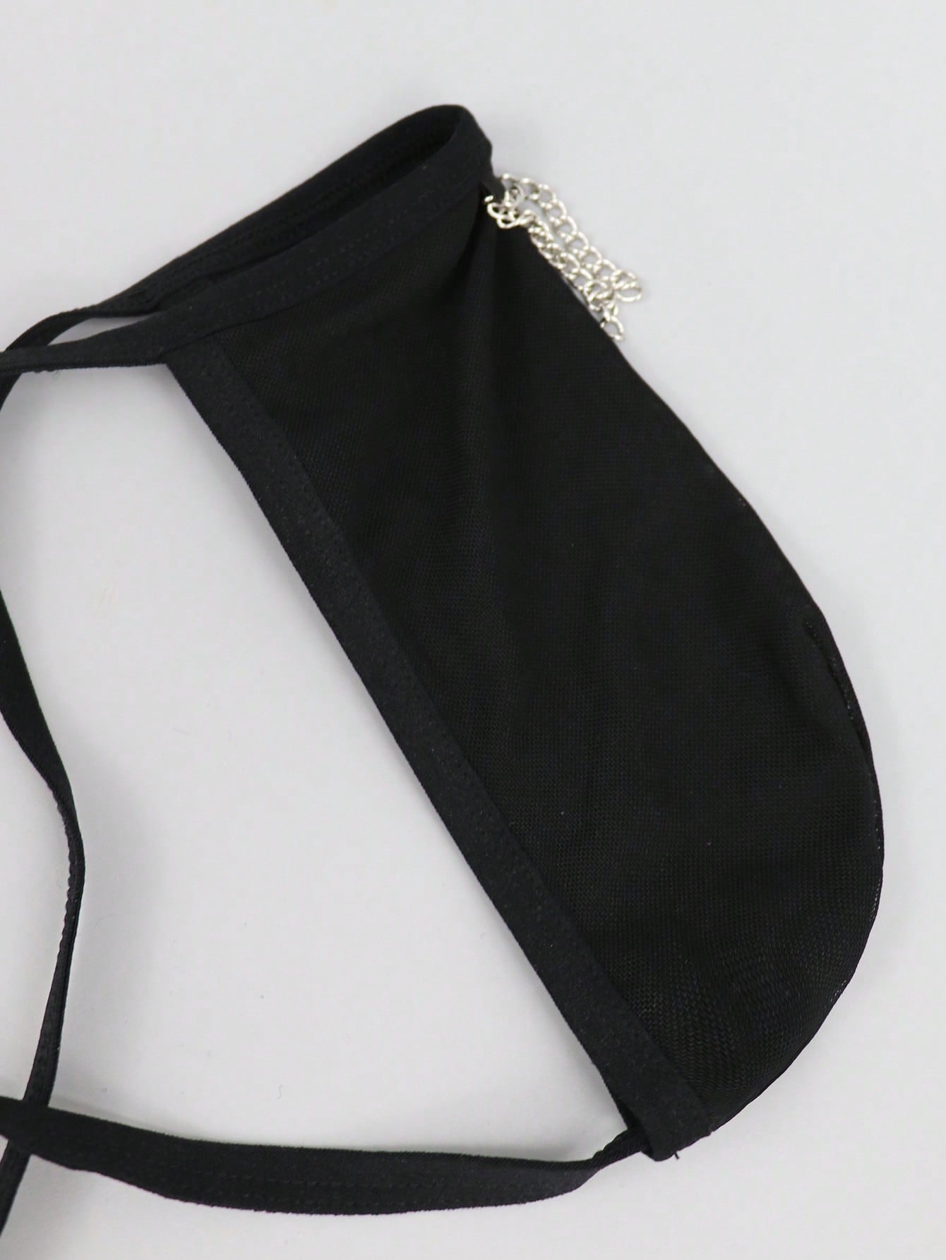 Black men's mesh thong underwear with a seamless low-rise design and medium-stretch fabric, one-piece style.