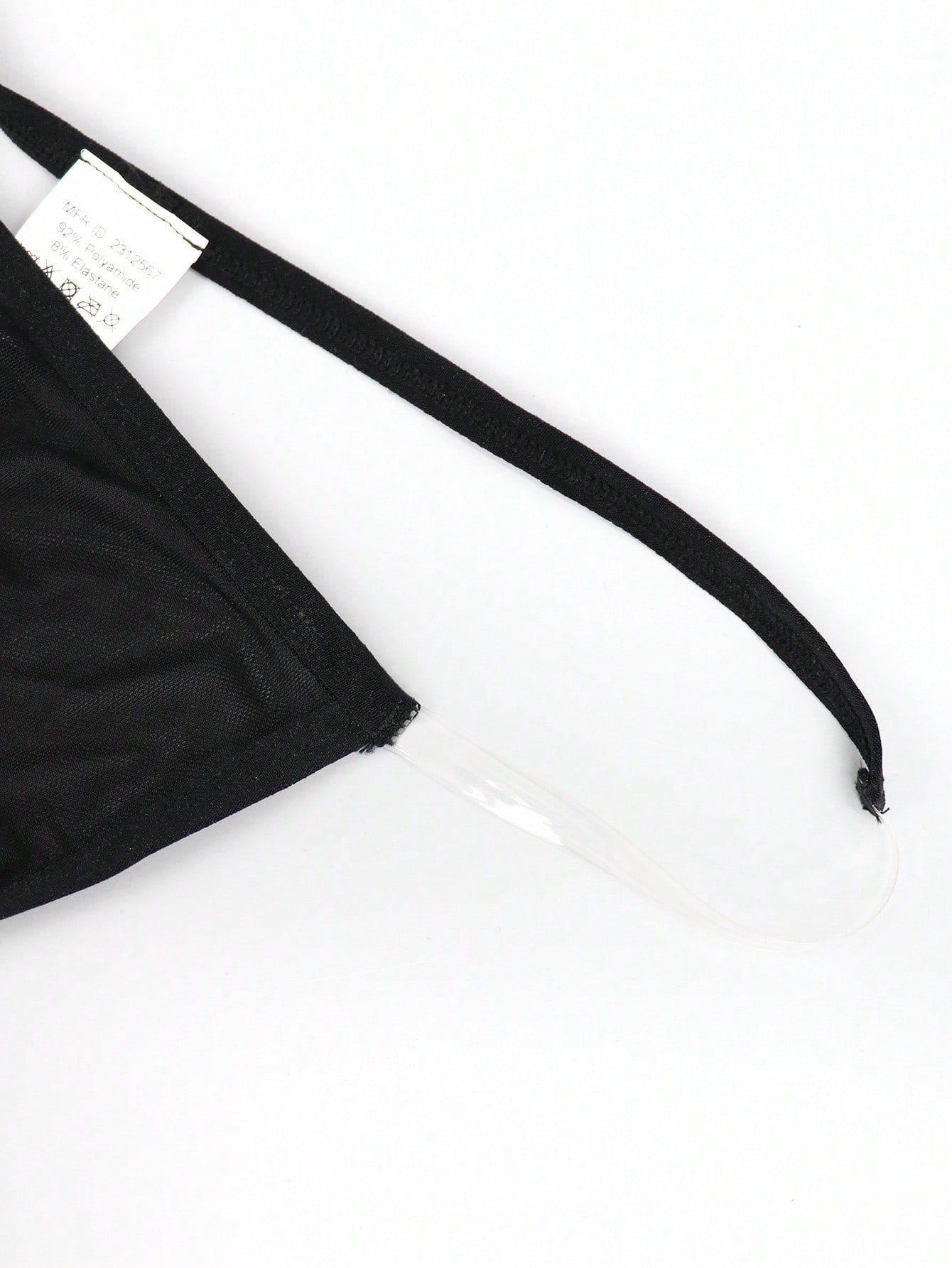 Black men's seamless mesh thong underwear with low-rise waist, colorblock design, and medium-stretch fabric.