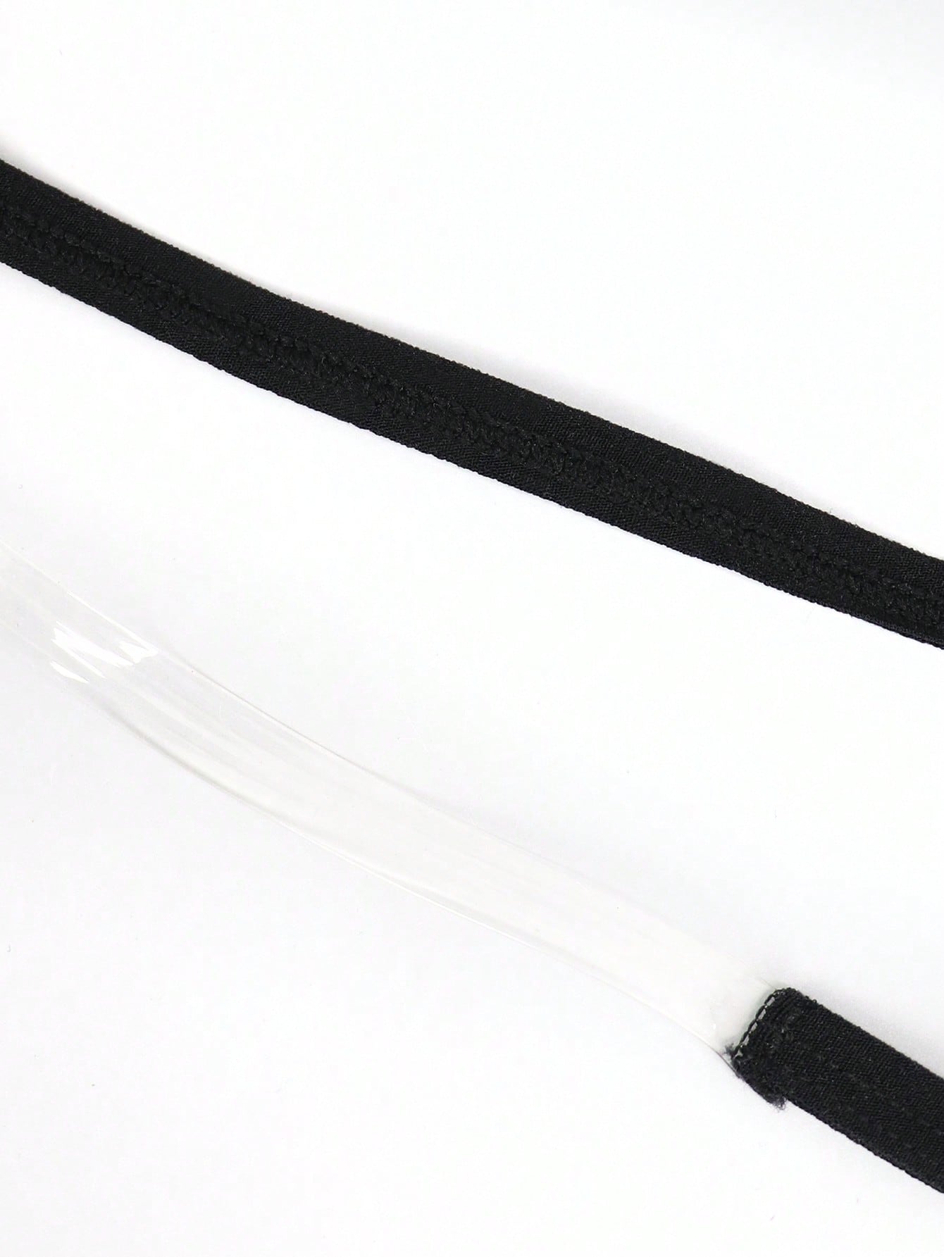 Black men's seamless mesh thong underwear with low-rise waist, colorblock design, and medium-stretch fabric.