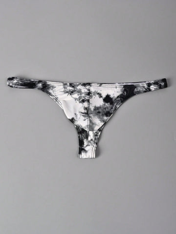 Men's tie dye thong underwear with a low rise fit and T-back design, made from polyester and elastane stretch fabric.