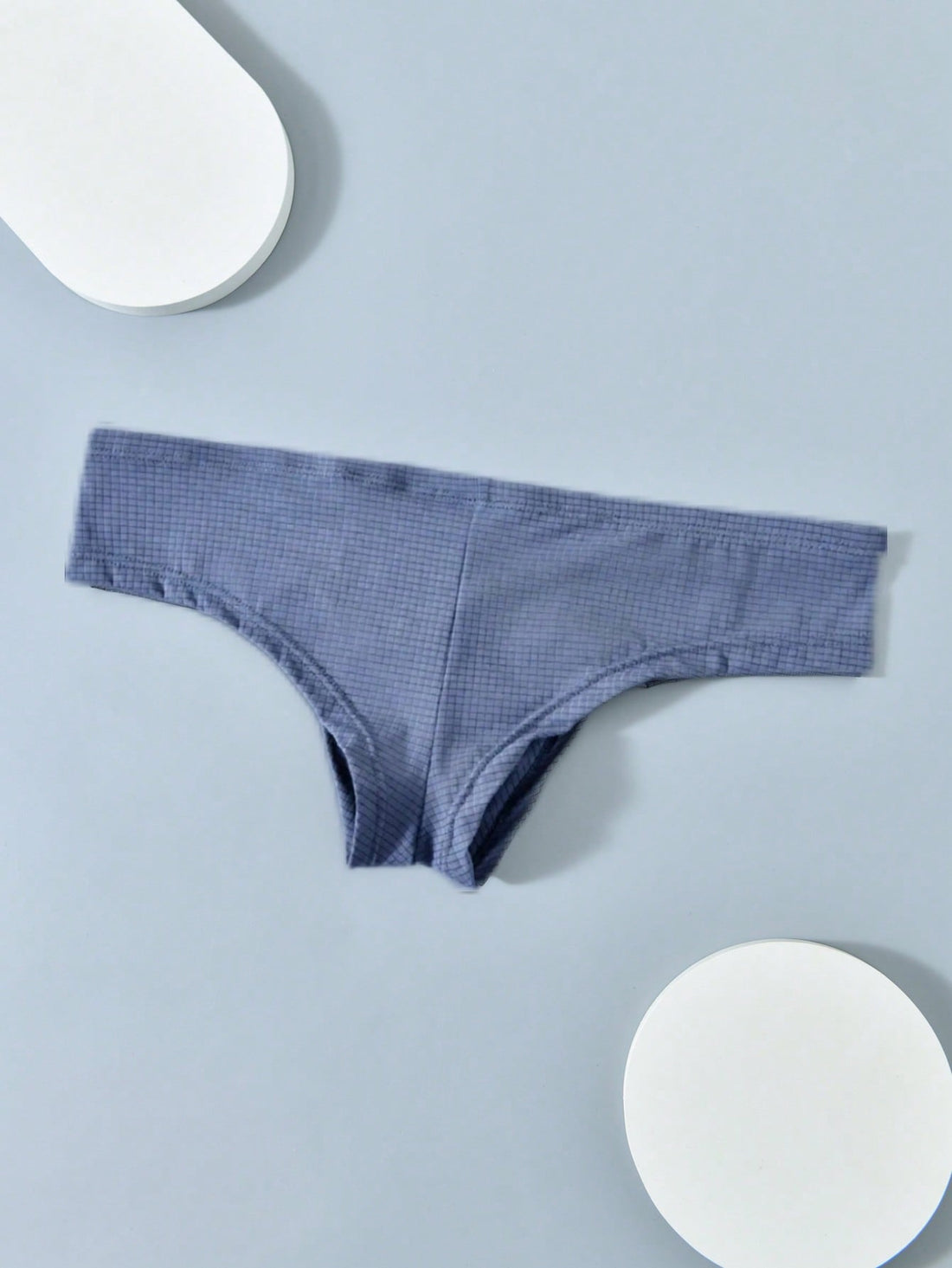 Men's soft thong underwear with low rise fit, plain design, and T-back style in polyester elastane fabric