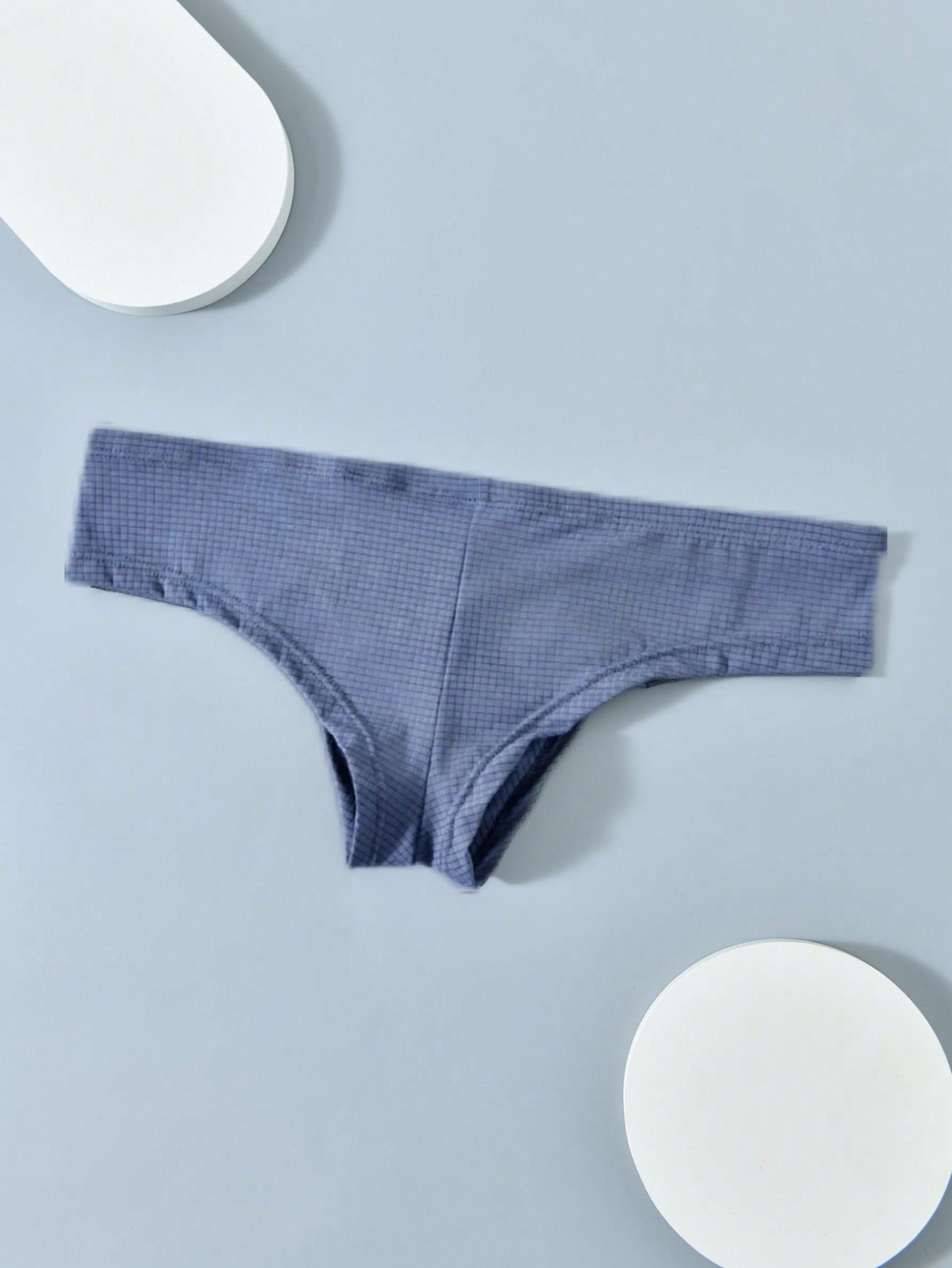 Men's soft thong underwear with low rise fit, plain design, and T-back style in polyester elastane fabric