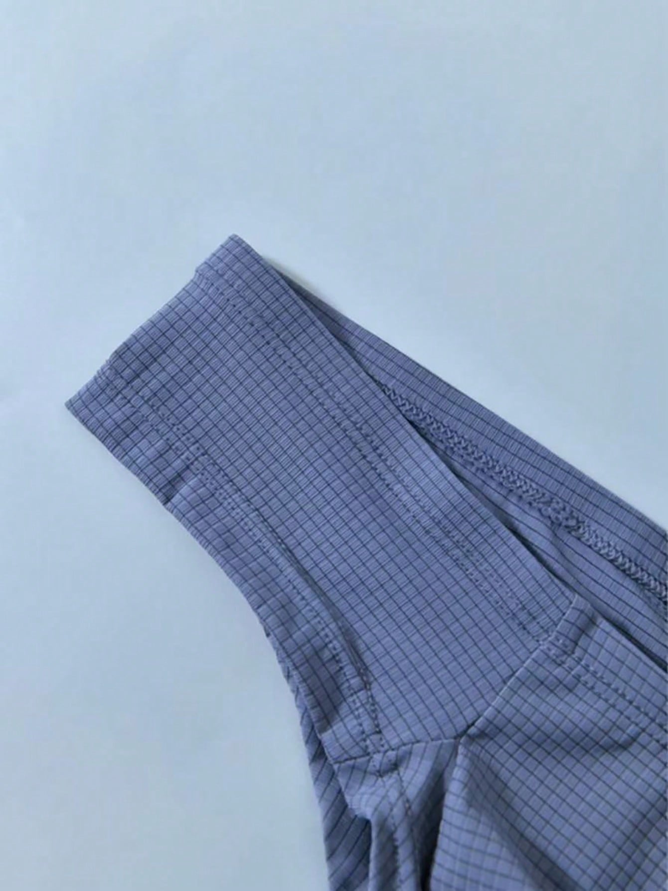 Men's soft thong underwear with low rise fit, plain design, and T-back style in polyester elastane fabric