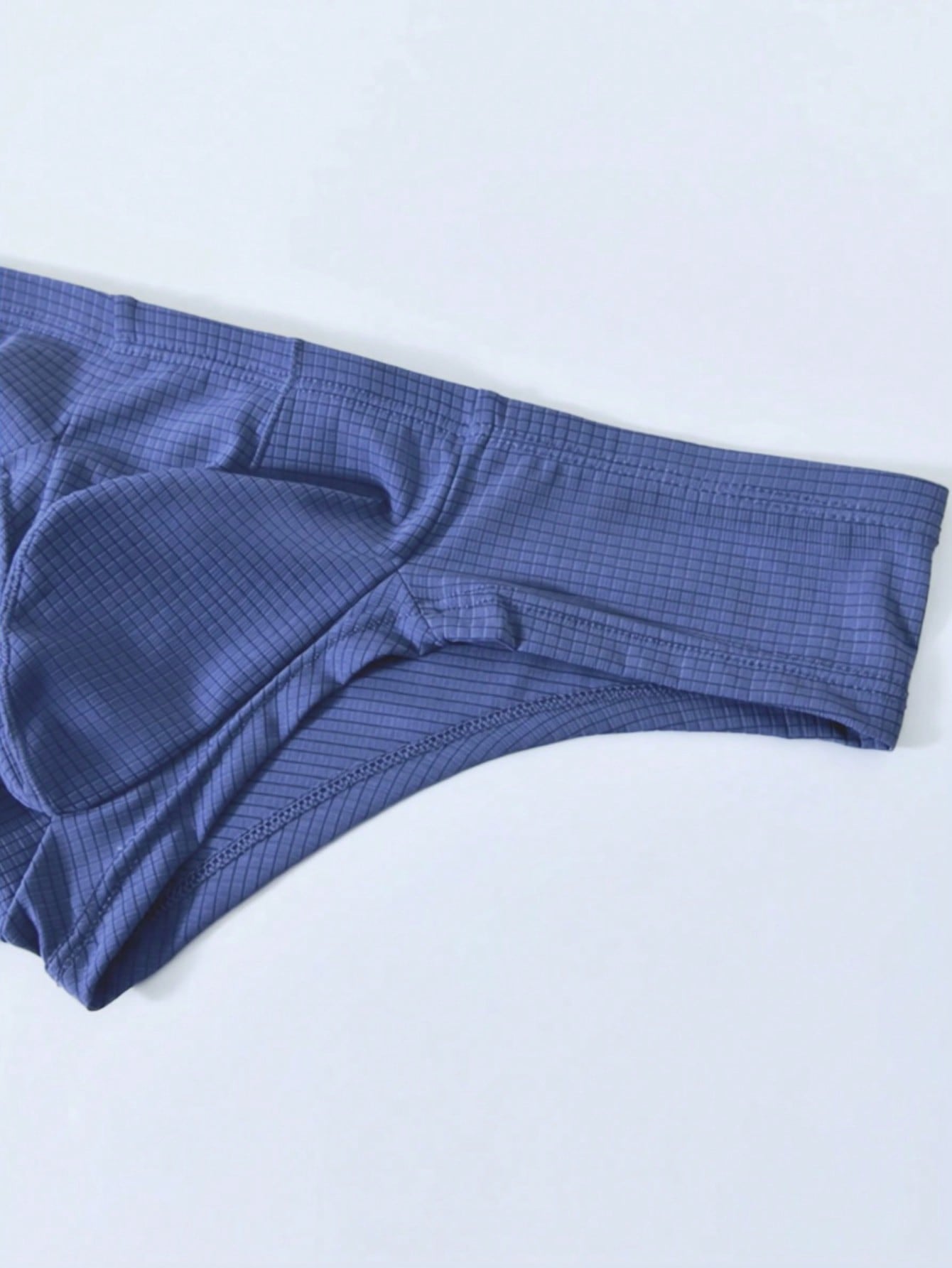 Men's soft thong underwear with low rise fit, plain design, and T-back style in polyester elastane fabric