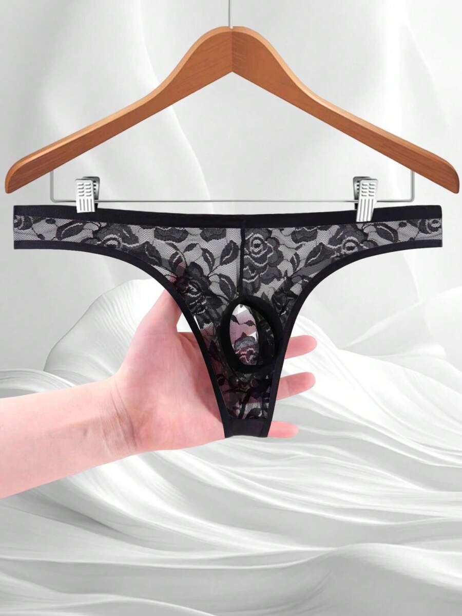 Men's black semi-sheer floral lace thong underwear featuring cut out design and low rise waistband.
