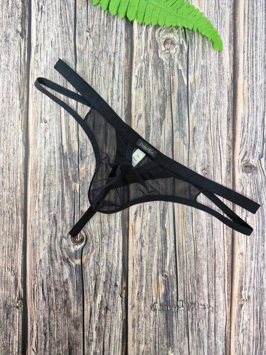 Men's black mesh G-string thong underwear featuring a low-waist cut-out front design.