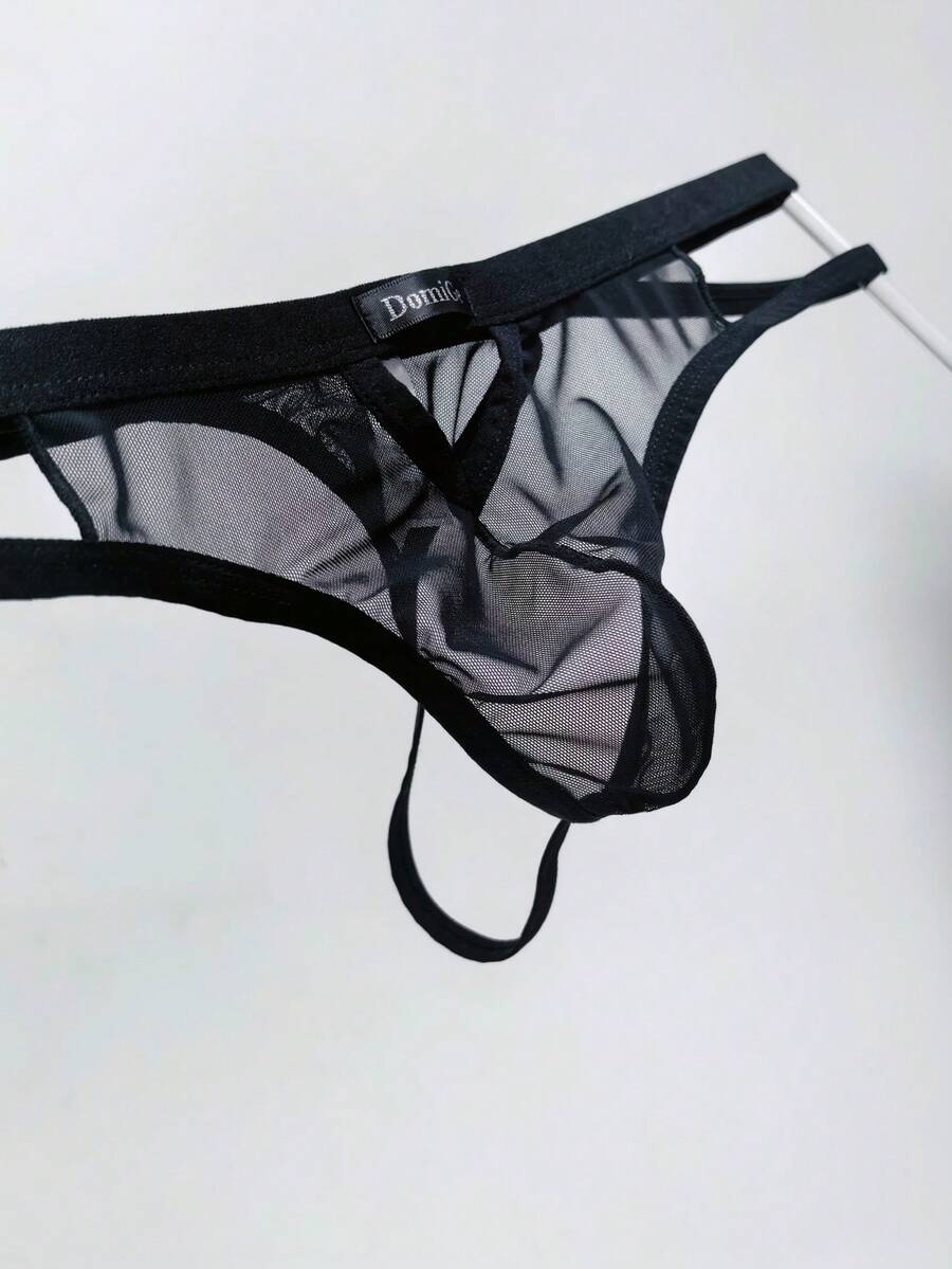 Men's black mesh G-string thong underwear featuring a low-waist cut-out front design.