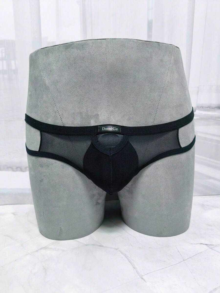 Men's black mesh G-string thong underwear featuring a low-waist cut-out front design.