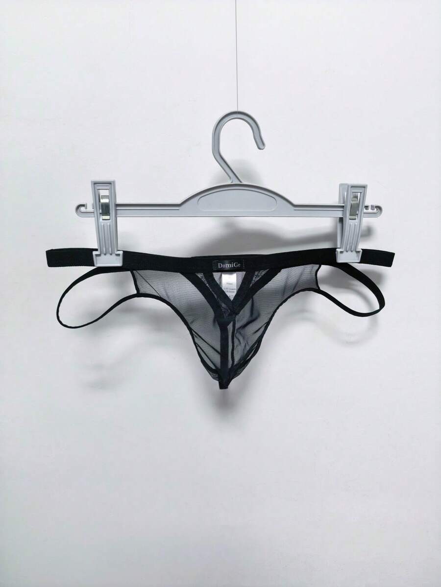 Men's black mesh G-string thong underwear featuring a low-waist cut-out front design.