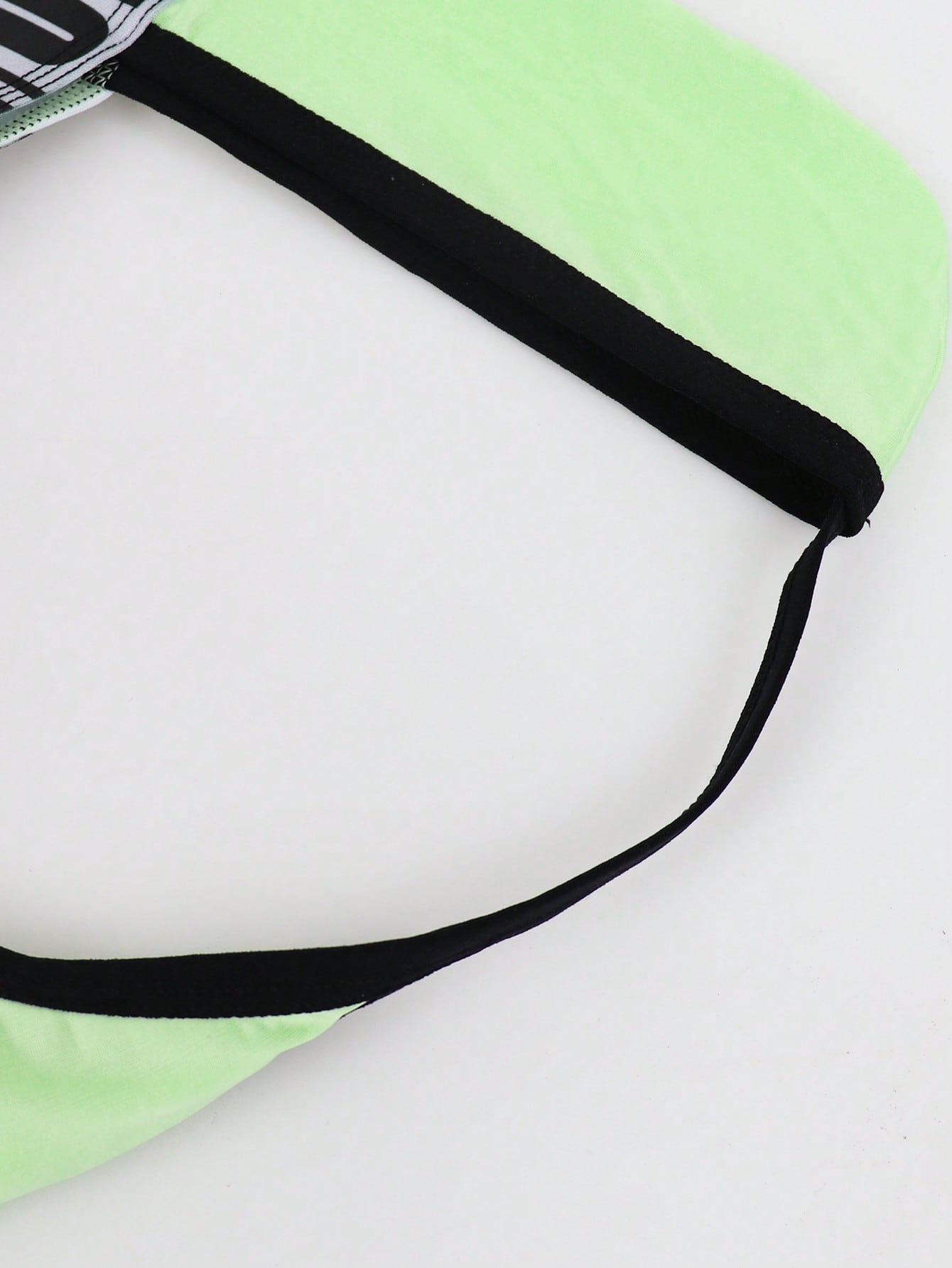Men's low rise thong underwear in knitted fabric with striped colorblock pattern and letter waistband.