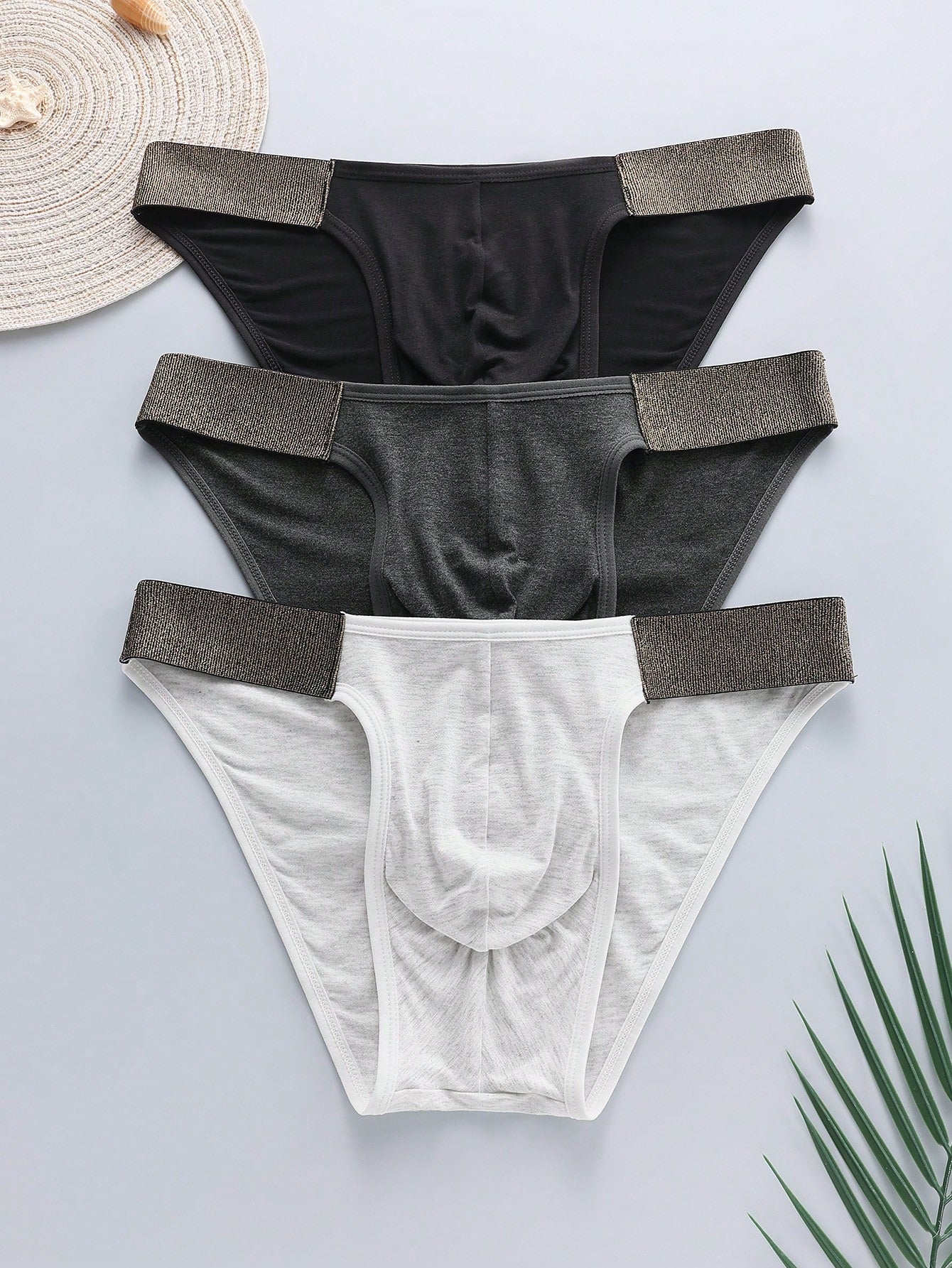 3-pack of men's plain low-rise briefs with contrast waistband, made from viscose blend knitted fabric with medium stretch
