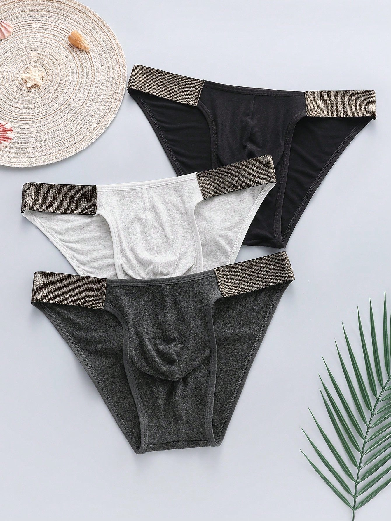 3-pack of men's plain low-rise briefs with contrast waistband, made from viscose blend knitted fabric with medium stretch