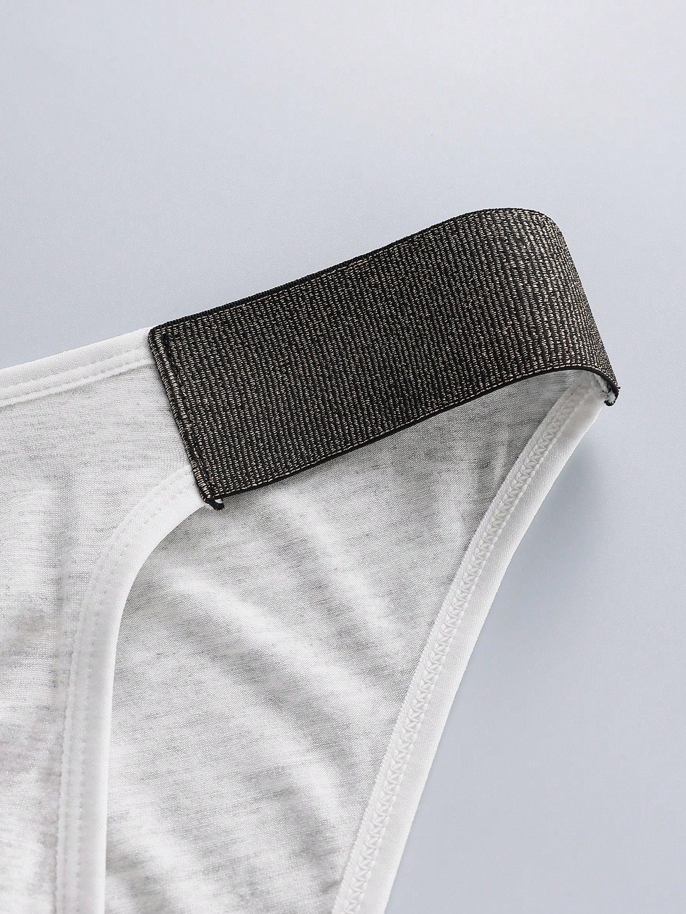 3-pack of men's plain low-rise briefs with contrast waistband, made from viscose blend knitted fabric with medium stretch