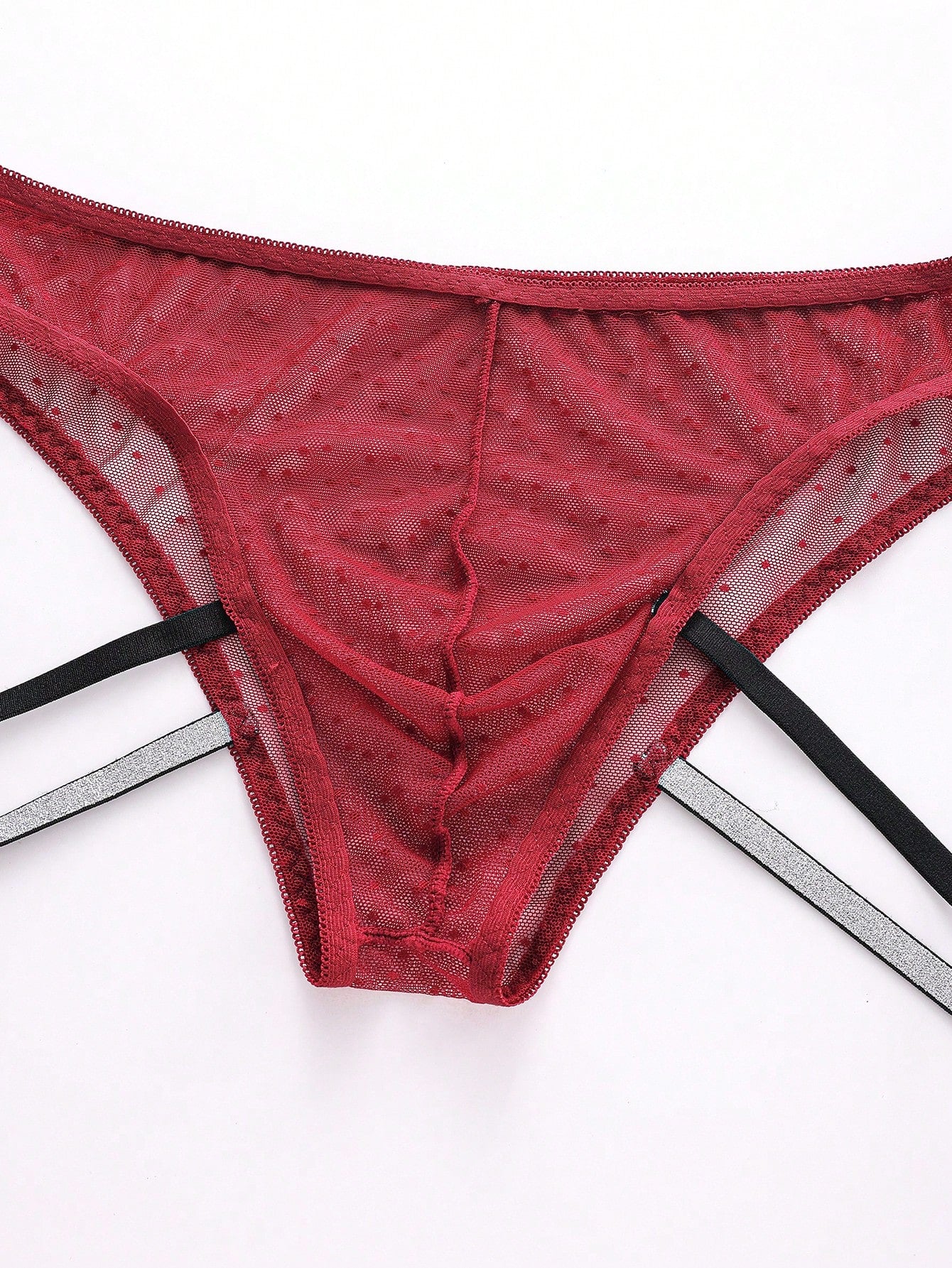 Men's low rise briefs in burgundy knitted fabric with lace trim, geometric pattern, medium stretch, and a semi-sheer finish.